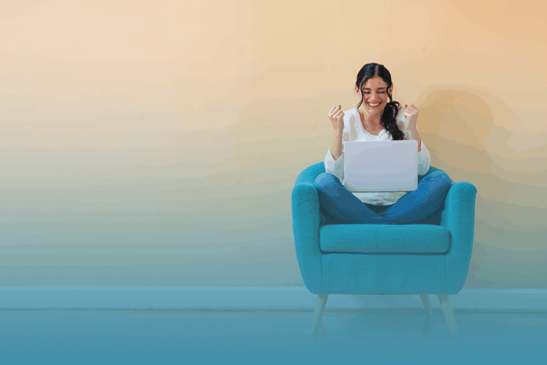 woman sits on couch in a successful pose as she discovers the power of self-improvement.